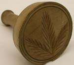 a%20wooden%20butter%20mold%20with%20a%20leaf%20design